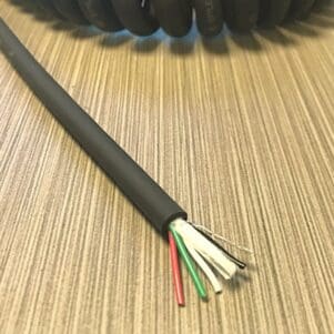 EC244 - Electronic Coiled Cord 24 Gauge with 4 Conductors - No Shield is a coiled cable with two wires on it.