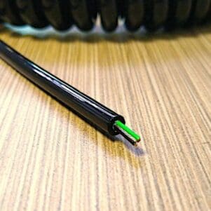 A ECS284 - Electronic Coiled Cord 28 Gauge with 4 Conductors - Aluminum Shielded on a table.