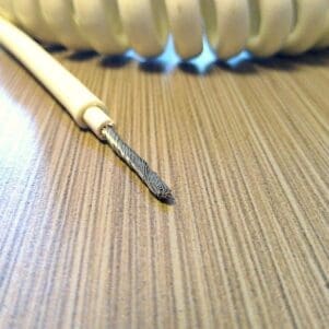 A PCE121 - 12AWG, 1 CONDUCTOR POWER COIL CABLE on a table.