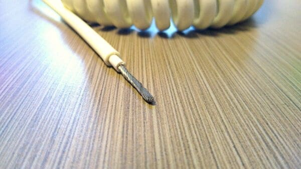 A PCE121 - 12AWG, 1 CONDUCTOR POWER COIL CABLE on a table.