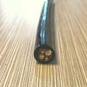 A black cable sitting on top of a table.