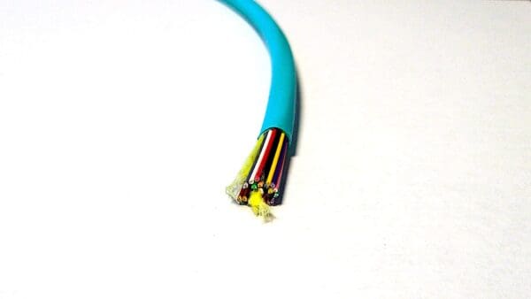 A FiOps300-24F - Aqua Blue cable with a wire attached to it.