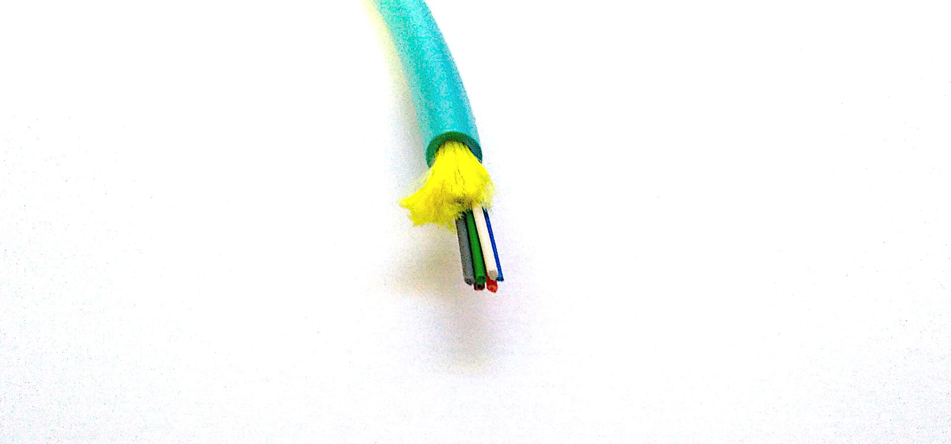 A FiOps240-6F - Aqua Blue cable on a white surface.