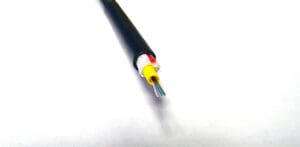 A FiOps310-6F - Black cable on a white surface.