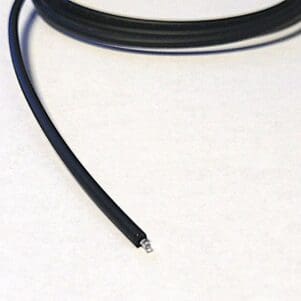 A FiOps039-PMR - Black wire on a white surface.