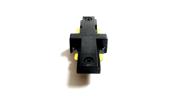 A Juno R23 Miniature Straight Connector (R-Type Tracks) with a roller lever, yellow actuators, and visible mounting holes, isolated on a white background.