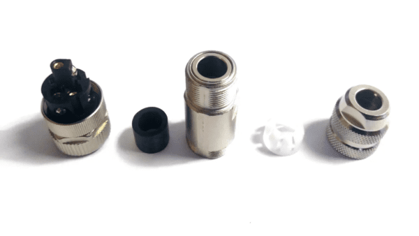 Four disassembled parts of an M12-5 connector, including a plug, cap, and shielding, arranged in a row on a white background.