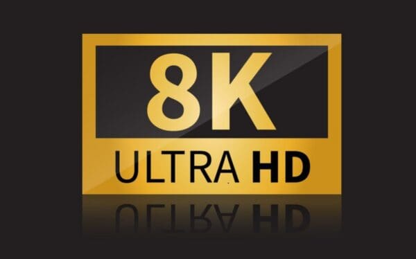 Logo of 8K Ultra High Speed HDMI Cable on a dark background with black and golden colors, reflecting HDR on the surface beneath it.