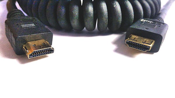 8K Ultra High Speed HDMI cable with coiled protective sleeve, featuring close-up view of both male connectors.